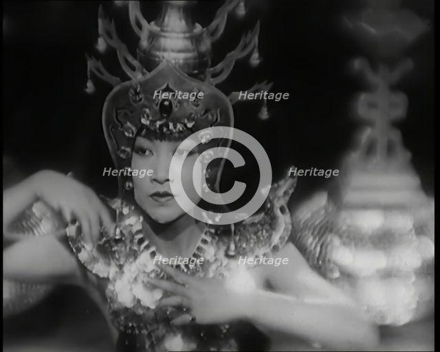 Scene from the Film 'Piccadilly': The Actor Anna May Wong Performing a Chinese Dance in..., 1920s. Creator: British Pathe Ltd.
