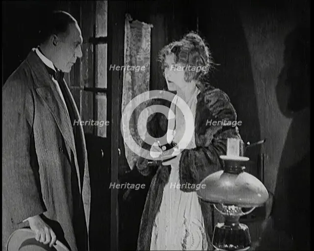 Scene from the Short Silent Feature Film 'Poppies of Flanders'. A Female Actor and a Male..., 1920s. Creator: British Pathe Ltd.