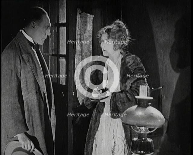 Scene from the Short Silent Feature Film 'Poppies of Flanders'. A Female Actor and a Male..., 1920s. Creator: British Pathe Ltd.