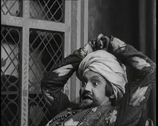 Scene from the Play Hassan': the Actor Henry Ainley in Full Costume Raising a Sword..., 1920s. Creator: British Pathe Ltd