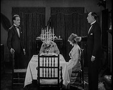 Scene from a 1920s Film. A Group of Actors Playing an Upper Class Family Sitting Down at..., 1920s. Creator: British Pathe Ltd