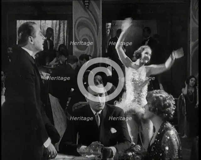 Scene from a 1920s Film. Two Actors Portraying a Couple in a Night Club Scene Whilst a Band...,1920s Creator: British Pathe Ltd.