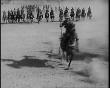 Scene from a Film: Actors Playing British Troops on Horseback Speeding Across a Desert..., 1920s. Creator: British Pathe Ltd