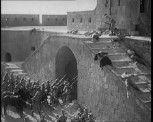 Scene from a Film: Actors Playing British Troops Storming a Fortress Whilst the Dead and..., 1920s. Creator: British Pathe Ltd