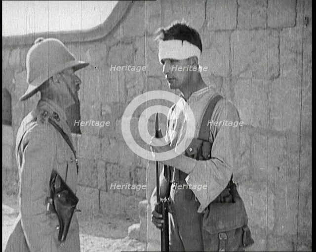 Scene from a Film: Male Actor Playing a Survivor from the Battle Being Questioned..., 1920s. Creator: British Pathe Ltd.