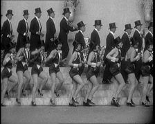 Scene from a Stage Show: a Large Dance Troop Tap Dancing on Steps in Top Hats, 1929. Creator: British Pathe Ltd
