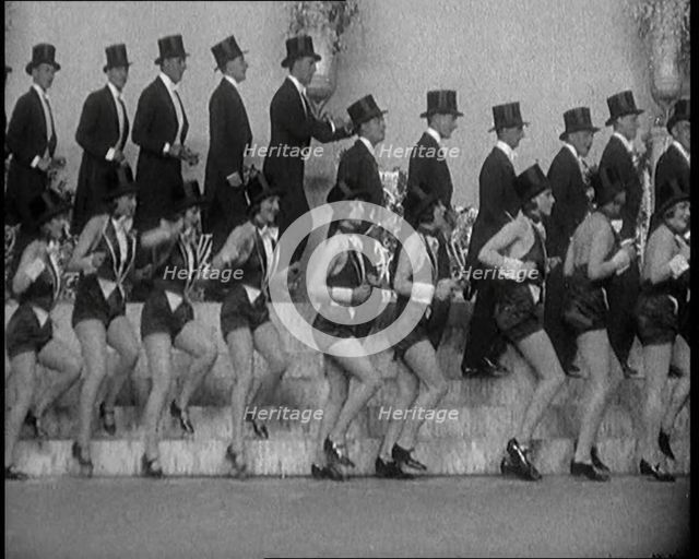 Scene from a Stage Show: a Large Dance Troop Tap Dancing on Steps in Top Hats, 1929. Creator: British Pathe Ltd.