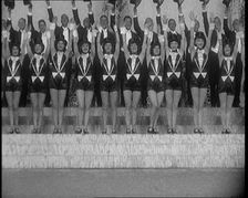 Scene from a Stage Show: a Large Dance Troop Tap Dancing on Steps in Top Hats, 1929. Creator: British Pathe Ltd