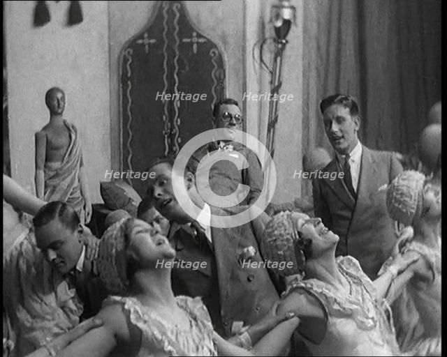 Scene from a Stage Show: Male and Female Civilians Dancing on a Stage in a Routine with..., 1929. Creator: British Pathe Ltd.