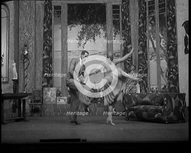 Scene from a Stage Show: Male and Female Civilians Dancing on a Stage in a Routine with..., 1929. Creator: British Pathe Ltd.