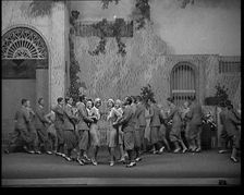 Scene from a Stage Show: Male and Female Civilians Dancing on a Stage in a Routine with..., 1929. Creator: British Pathe Ltd