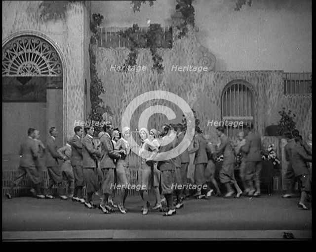 Scene from a Stage Show: Male and Female Civilians Dancing on a Stage in a Routine with..., 1929. Creator: British Pathe Ltd.