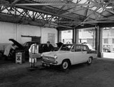 Scene in Globe & Simpson's auto electrical workshop, Nottingham, Nottinghamshire, 1961. Creator: Michael Walters