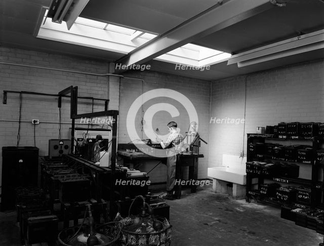 Scene in the workshops of Globe & Simpson auto electricians, Lincoln, Lincolnshire, 1961. Artist: Michael Walters