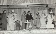 Scene with nine people, 1937. Creator: Unknown