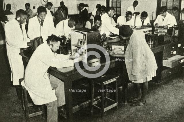 'Scenes in a Native College - Students in the physics laboratory', c1948. Creator: Unknown.