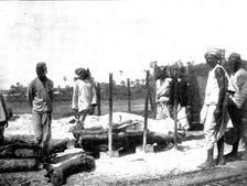 Scenes in Plague-Stricken Bombay: body lying on the pyre..., 1898. Creator: Gysi