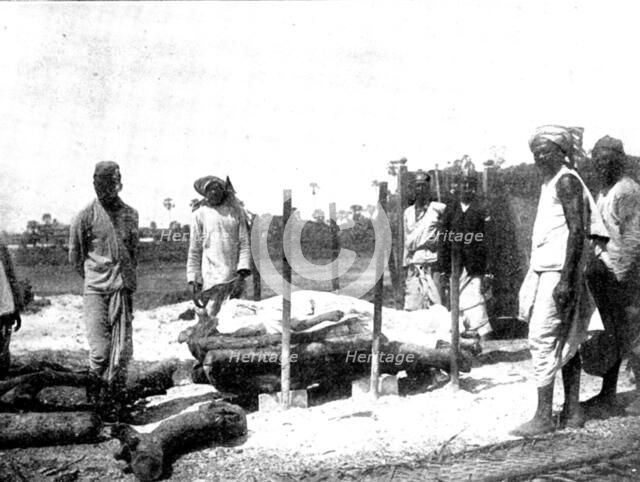 Scenes in Plague-Stricken Bombay: body lying on the pyre..., 1898. Creator: Gysi.