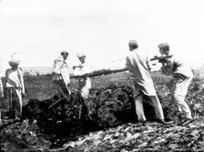 Scenes in Plague-Stricken Bombay: burying a poor man...[without funds for] cremation...., 1898. Creator: Gysi