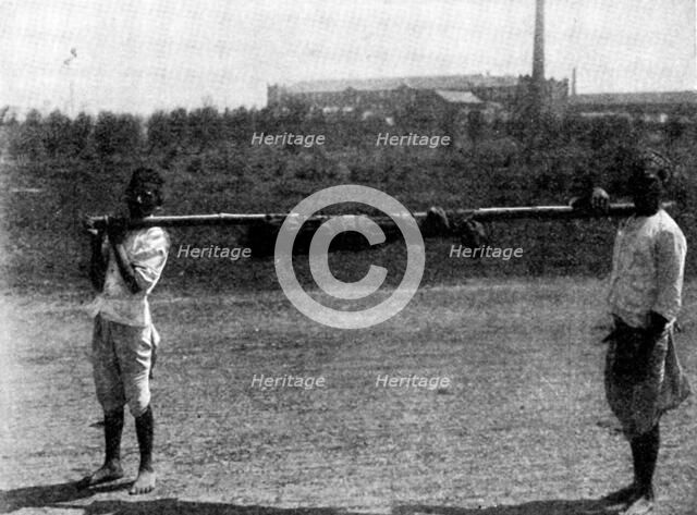 Scenes in Plague-Stricken Bombay: removing body of a...child to the...burning-ground, 1898. Creator: Gysi.