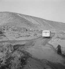 School bus starts up the flat 7:30 a.m. to collect children of new..., Malheur County, Oregon, 1939. Creator: Dorothea Lange