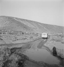 School bus starts up the flat 7:30 a.m. to collect..., Malheur County, Oregon, 1939. Creator: Dorothea Lange
