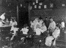 School children conducting simple experiments, Washington, D.C., (1899?). Creator: Frances Benjamin Johnston