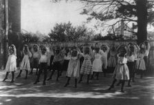 School children learning a dance in a school yard, Washington, D.C., (1899?). Creator: Frances Benjamin Johnston