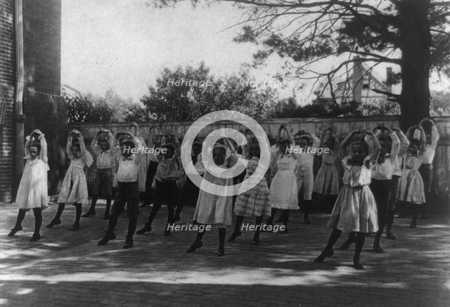 School children learning a dance in a school yard, Washington, D.C., (1899?). Creator: Frances Benjamin Johnston.