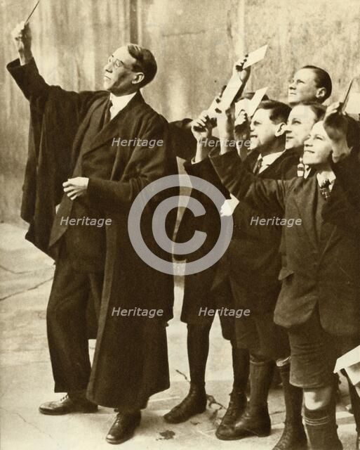 Schoolboys and teacher observing a solar eclipse, Britain, 1921, (1935). Creator: Unknown.