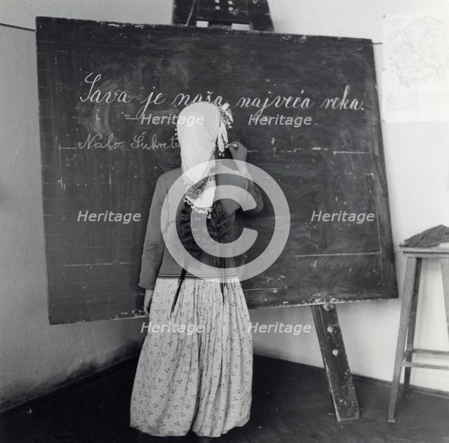 Schoolgirl in Sarajevo, Bosnia-Hercegovina, Yugoslavia, 1939. Creator: Unknown.