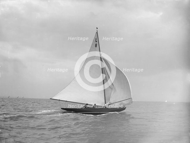 'Scotia IV' running downwind with spinnaker, 1913. Creator: Kirk & Sons of Cowes.