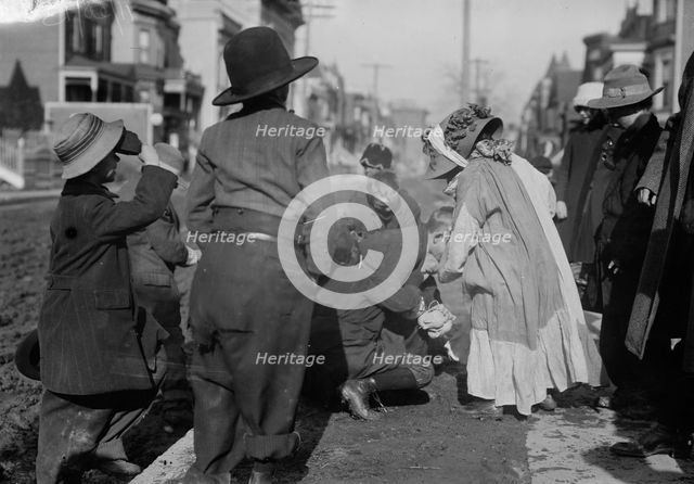 Scramble for pennies, Thanksgiving, between c1910 and c1915. Creator: Bain News Service.