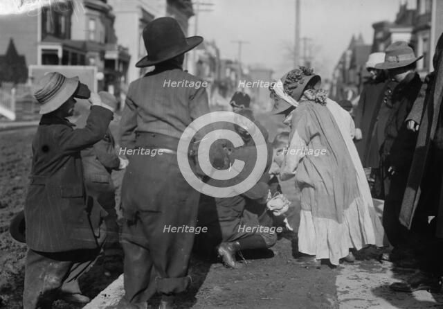 Scramble for pennies, Thanksgiving, between c1910 and c1915. Creator: Bain News Service.