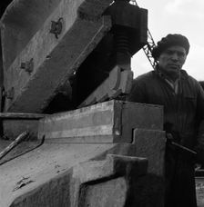 Scrapyard worker, Rotherham, South Yorkshire, 1963. Creator: Michael Walters