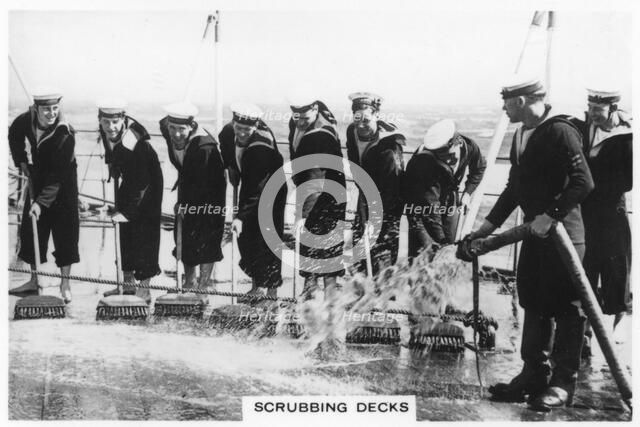 Scrubbing the deck on board HMS 'Nelson', 1937. Artist: Unknown