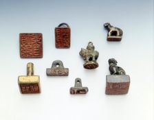Set of 8 bronze seals, China. Creator: Unknown