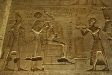 Seti I offering a statue of goddess Maat to gods Osiris..., Temple of Seti I, Abydos, Egypt (2003). Creator: LTL