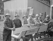 Seven of the eight farmers shown with their coop...West Carlton, Yamhill County, Oregon, 1939. Creator: Dorothea Lange