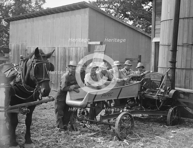Seven of the eight farmers shown with their cooperatively owned...Yamhill County, Oregon, 1939. Creator: Dorothea Lange.