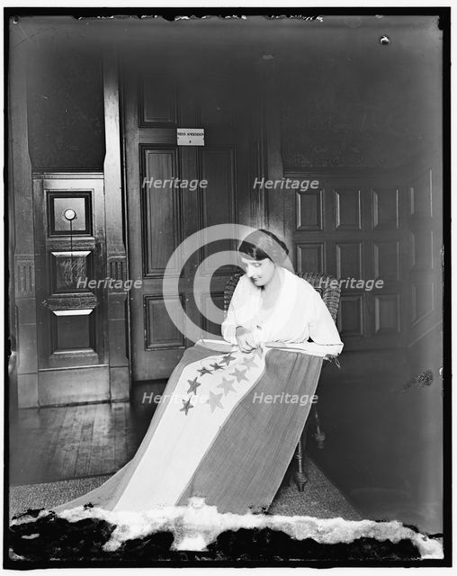 Sewing stars on suffrage flag, between 1910 and 1920. Creator: Harris & Ewing.