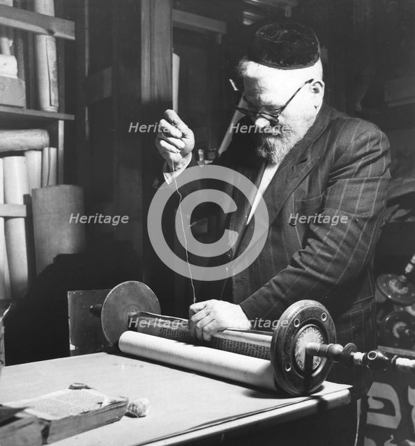 Sewing together completed sections of a Sefer Torah, 1974. Creator: Unknown.