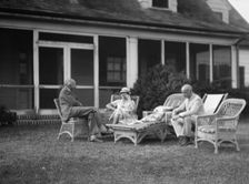 Sexton, Mr. and Mrs., and an unidentified man, seated outdoors, between 1932 and 1936. Creator: Arnold Genthe