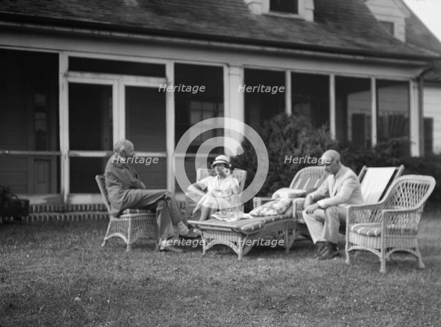 Sexton, Mr. and Mrs., and an unidentified man, seated outdoors, between 1932 and 1936. Creator: Arnold Genthe.
