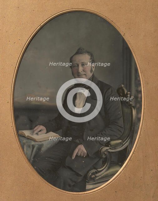 Seated Man Pointing to a Passage in an Open Book, 1850s. Creator: John Jabez Edwin Mayall.