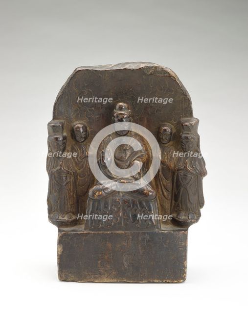Seated Buddha (Shakyamuni) with standing monks and bodhisattvas..., Period of Division, 535. Creator: Unknown.