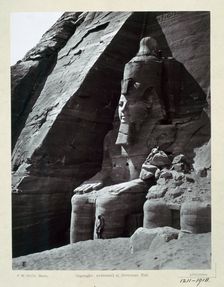 Seated colossus of Rameses II, Temple of Abu Simbel, Egypt, c1860-1890. Creator: Frank Mason Good