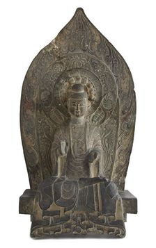 Seated figure of the Buddha Sakyamuni in high relief, Period of Division, 534-550. Creator: Unknown