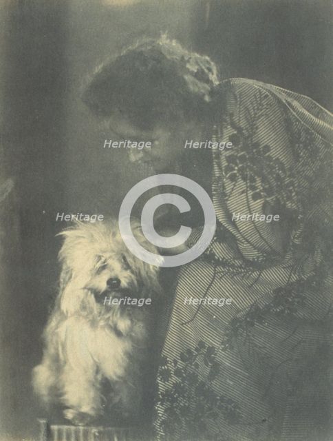 Seated woman petting her white dog, c1900. Creator: Virginia M Prall.