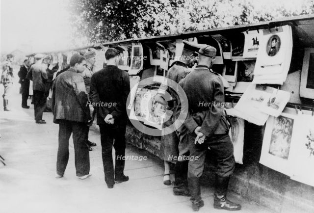 Second-hand book and print stalls on the bank of the Seine, German-occupied Paris, 1940. Artist: Unknown